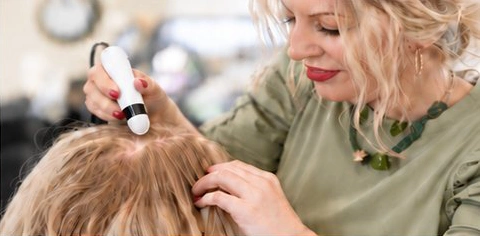 Sanchia carrying out a close scalp analysis