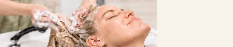 Relaxed client receiving a gentle cleansing ritual