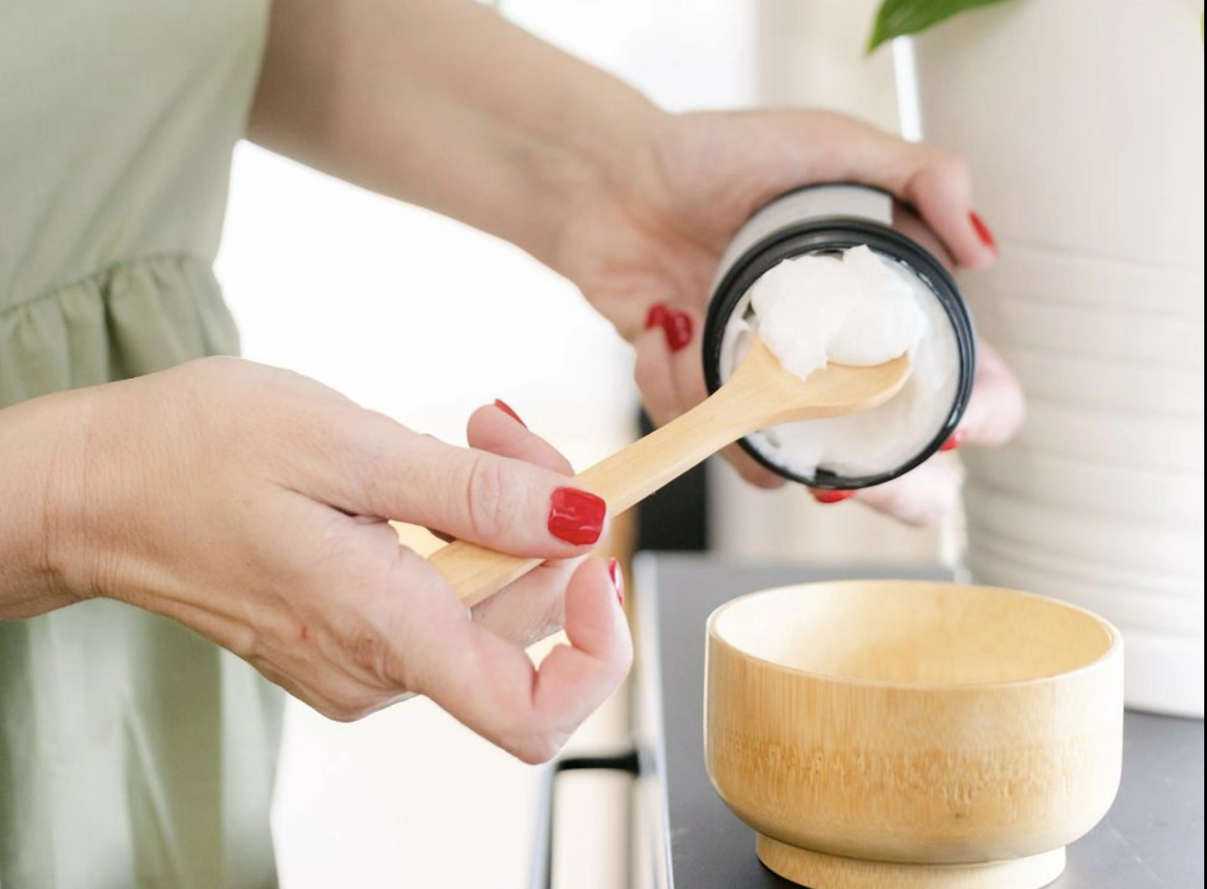 Preparing a personalised botanical
        treatment in a wooden bowl