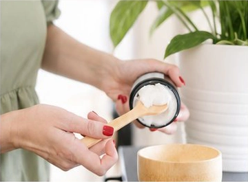 Preparing a personalised botanical
        treatment in a wooden bowl
